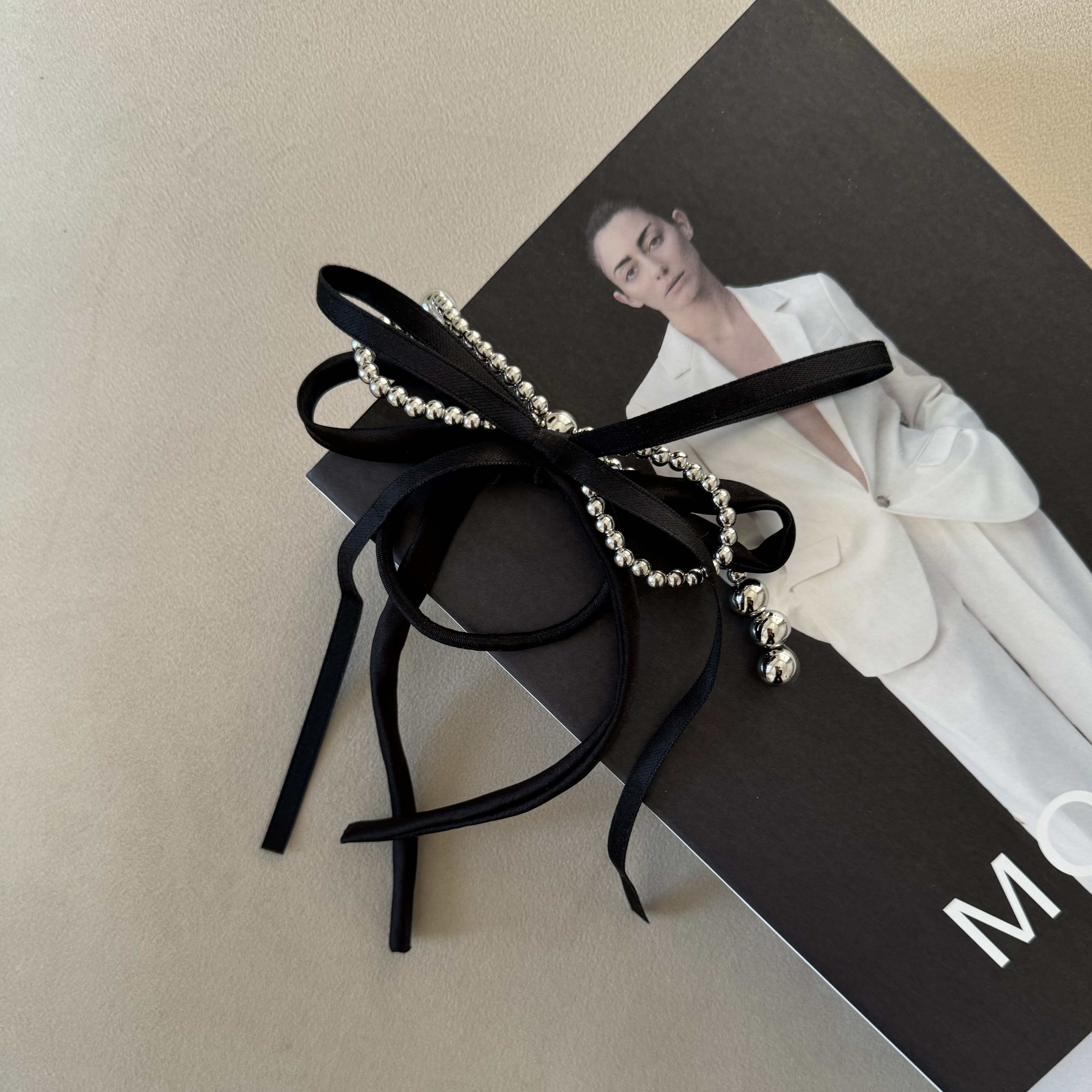 картинка Резинка для волос "Черный бантик"